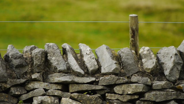 A rock fence acts as a boundary
