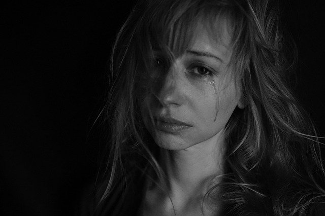 postpartum depression, woman crying, black and white