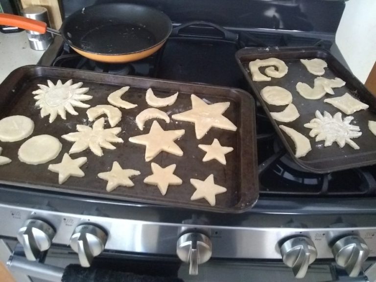 Cookie shapes are on baking sheet