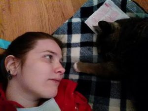 Karina and a cat lying together