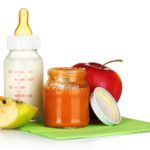 baby food, baby bottle, and an apple