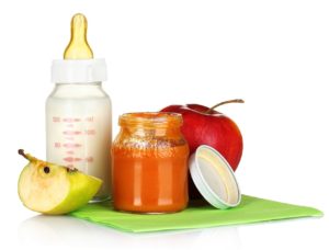 baby food, baby bottle, and an apple