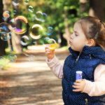 Age appropriate behavior, child bloing bubbles
