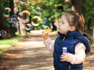 Age appropriate behavior, child bloing bubbles