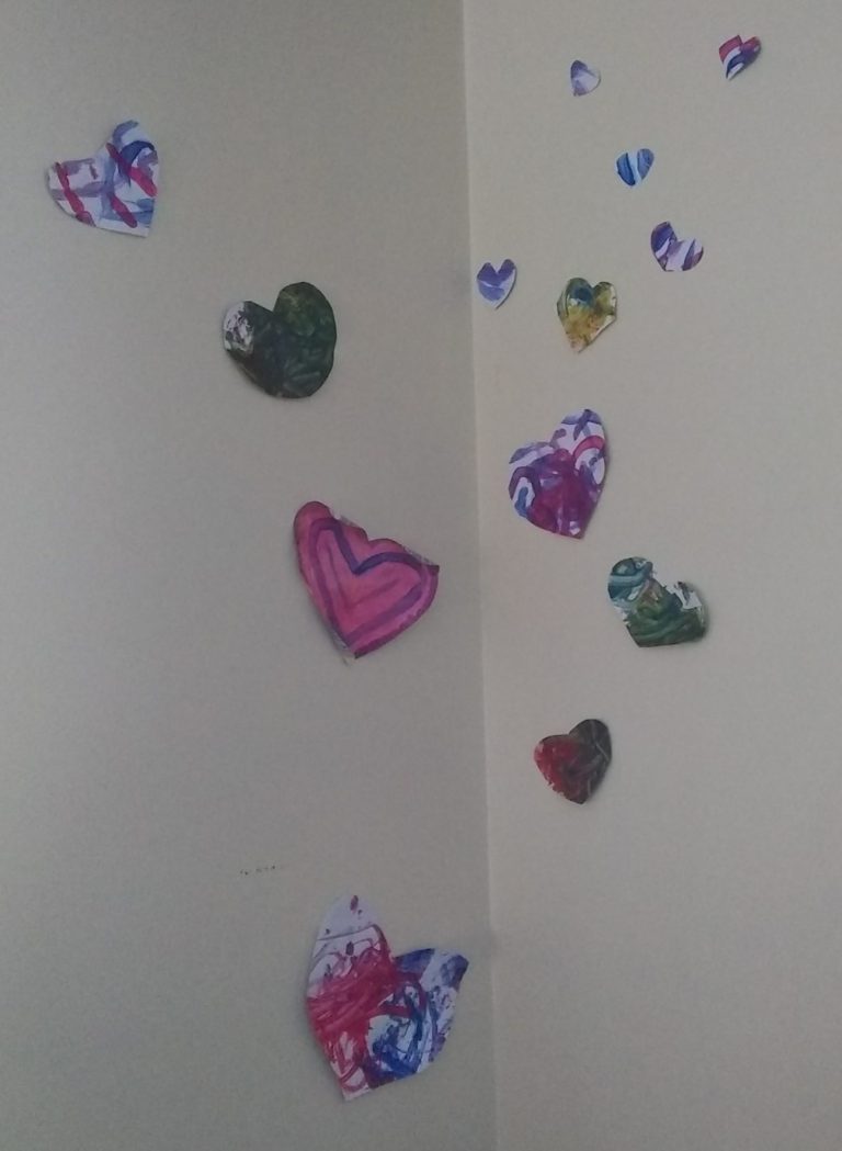 open ended art, painted hearts upon the wall